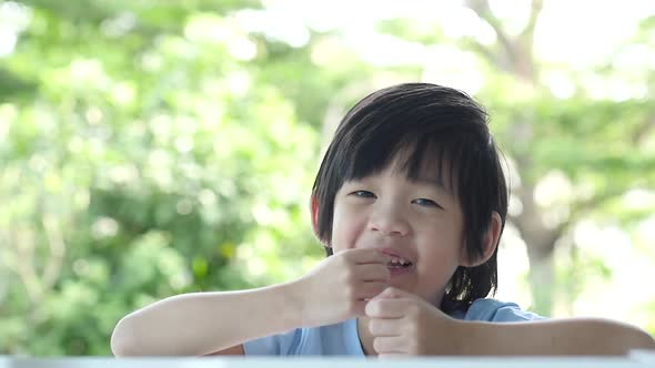 Close Up Of Happy Asian Child Slow Motion