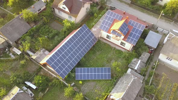 Aerial View of a Private House with Solar Panels on Roof