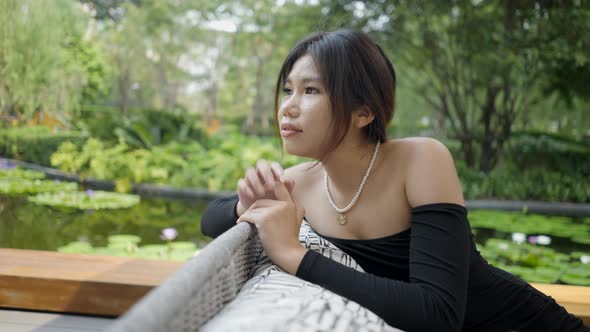 An Asian Beauty Being Fascinated Looking at Nature