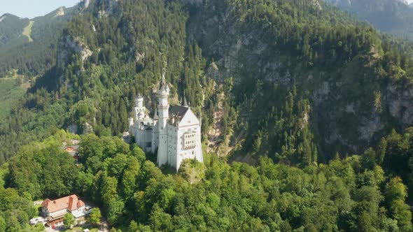 Fly Around Neuschwanstein Castle at Green Landscape Bavaria Germany