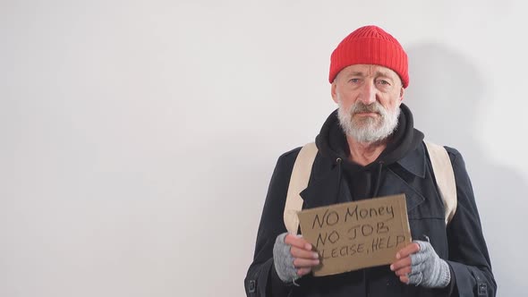 Homeless Man Holding Sign, Request for Help, Seeking Help Posing at Studio