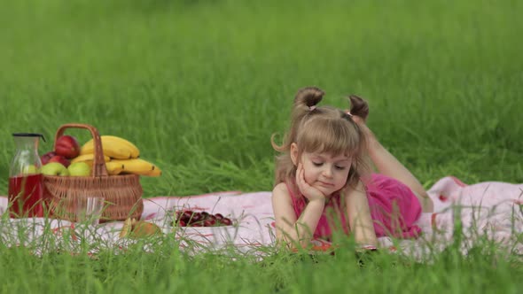 Weekend at Picnic. Girl on Grass Meadow Play Online Games on Mobile Phone. Social Network, Chatting