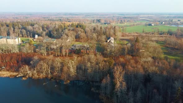 Old Red Brick House, Katvari Manor in Latvia and Katvaru Lake in the Background. View From Above. In