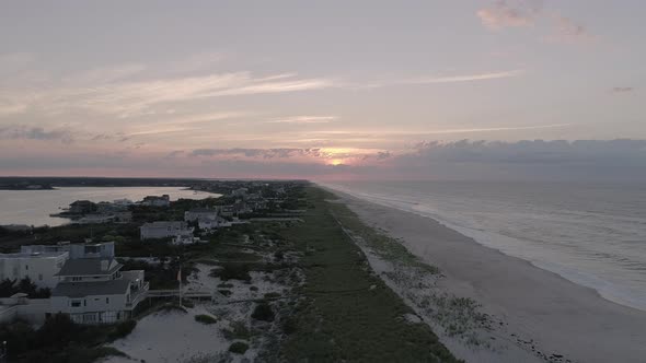 Aerial of the Sunset Over Houses and the Beach in the Hamptons