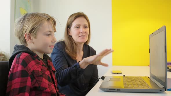 Woman and boy with laptop