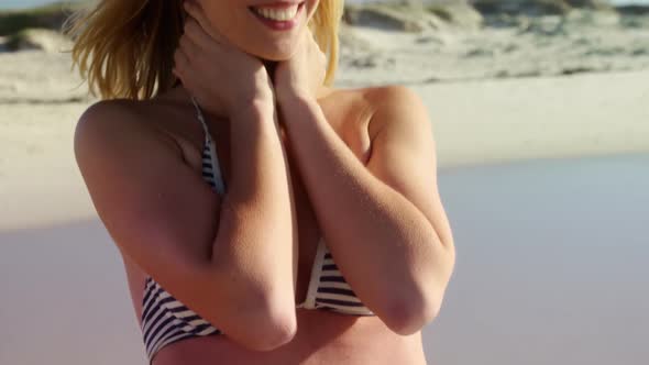 Young woman standing at beach