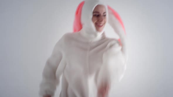 Portrait of a young cute girl in a beautiful hare costume