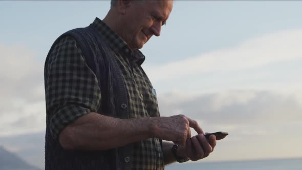 Senior man using his mobile phone