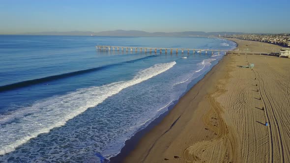 Aerial drone uav view of a pier over the beach and ocean