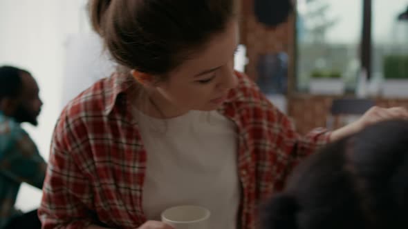 Teacher Explaining to Young Woman How to Draw Vase Model