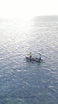 Vertical Video Boats in the Ocean Near the Coast of Zanzibar Tanzania