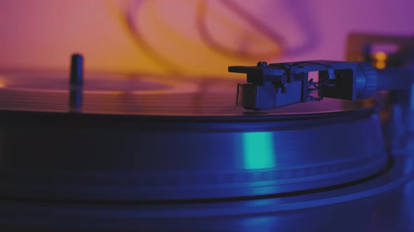 A Vinyl Record Spins in the Gramophone Music Player and Plays an Old Disco