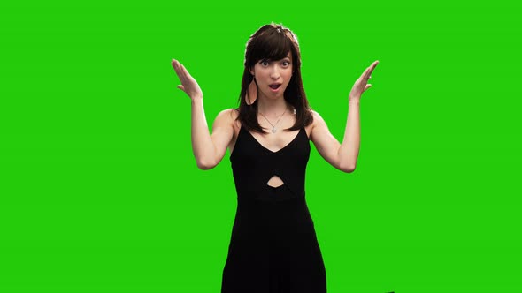Portrait of adorable slim woman surprised on green screen