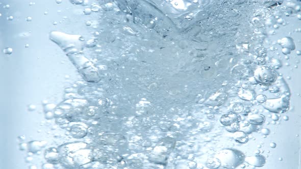 Super Slow Motion Shot of Oil and Water Blue Whirl at 1000Fps alt