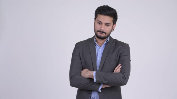 Young Handsome Bearded Indian Businessman with Arms Crossed