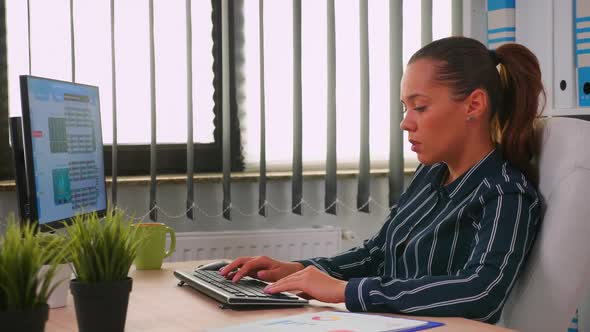 Business Woman Typing on Computer