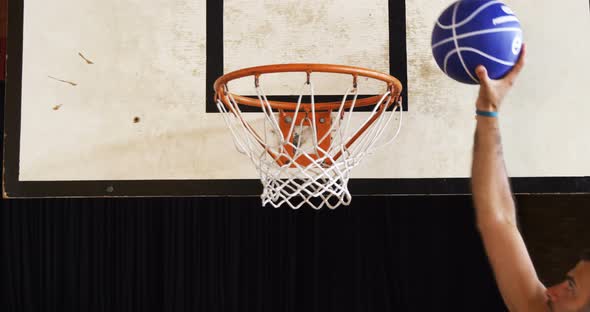 Basketball players playing in the court