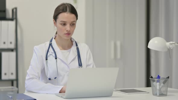 Female Doctor Working on Laptop 