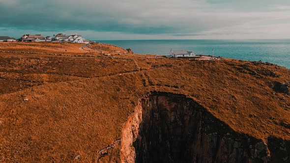 Building on the background of the ocean on top of a cliff Aerial view.