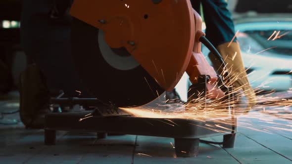 Professional Mechanic is Cutting Steel Metal