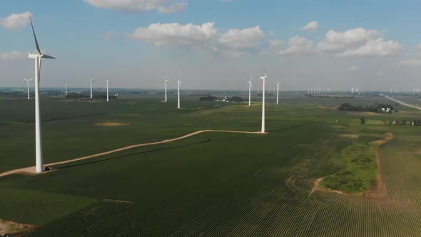 Flying over service roads and corn fields at a wind generator farm in Iowa.