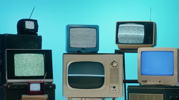 Old Televisions with Grey Interference Screen on Blue Neon Background