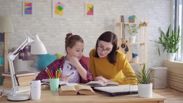 Mom Helps Daughter To Do Homework