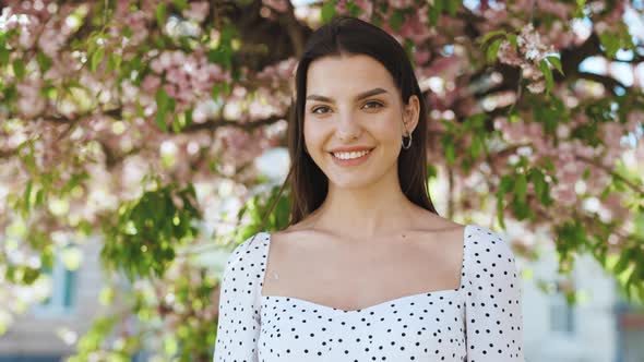 Smiling Confident Young Ethnic Woman Pretty Face Looking at Camera Posing Alone at Park