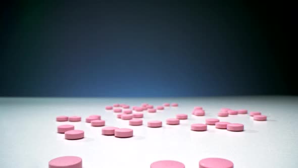 Macro Of Pink Pills On White Table