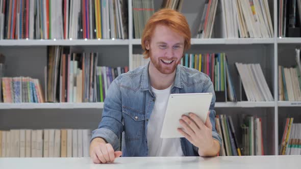Online Video Chat on Tablet By Redhead Man