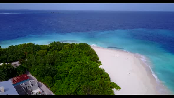 Aerial top down texture of exotic resort beach holiday by blue green ocean with white sand backgroun