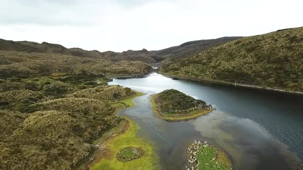 Beautiful aerial drone shot over a mountain range and river in South America