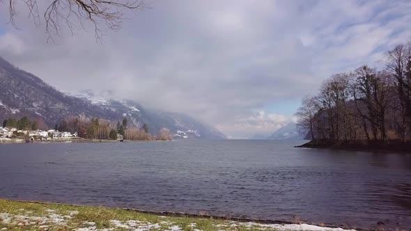 Passing by under a tree over a lake in Switzerland