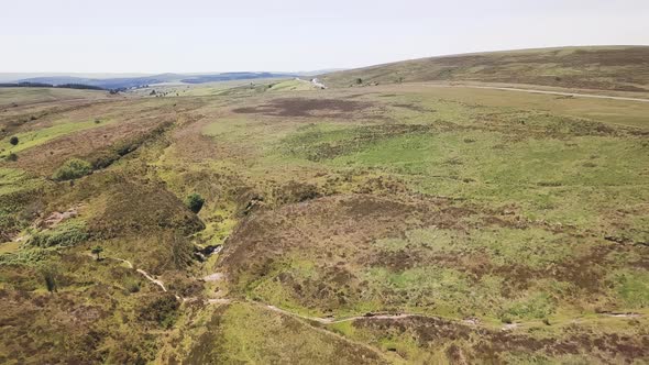 RISING AERIAL DRONE video looking over moorland