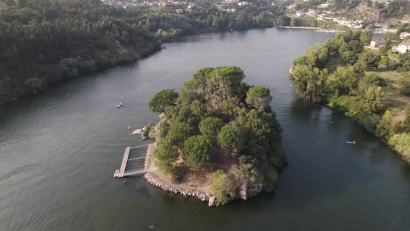 Ilha dos Amores or Island love in river middle, Castelo de Paiva in Portugal. Aerial drone orbiting