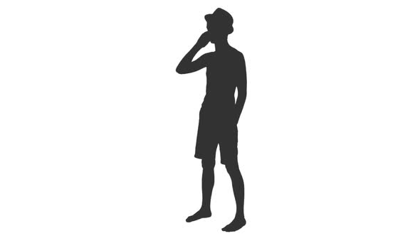 Silhouette of Young Shirtless Man Standing and Talking on Smartphone alt