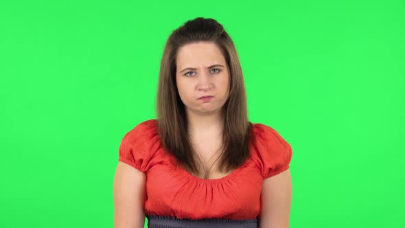 Portrait of Cute Girl Is Waiting and Angry. Green Screen