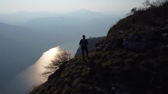 Hiker on top of the mountain, Lake Como, European Alps, Italy