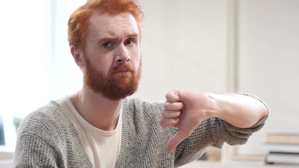 Thumbs Down by Man with Red Hairs