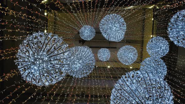 Industrial Climber Sets Up Christmas Decorations in the Shopping Centre