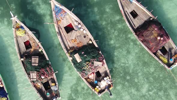 Vertical Video Boats in the Ocean Near the Coast of Zanzibar Tanzania Aerial View