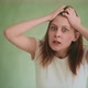 Angry Young Woman in Tshirt Clutches Head and Pulls Hair - VideoHive Item for Sale