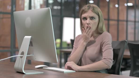 Young Woman Get Shocked While Working on Computer