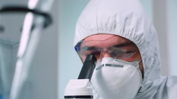 Close Up of Scientist Carrying Out Genetic Analysis Using Microscope