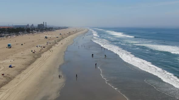 Aerial View of Huntington Pier, Beach and Coastline During Sunny Summer Day