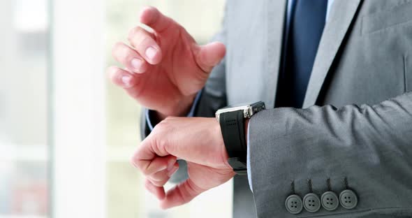 Business Man Using His Smart Watch