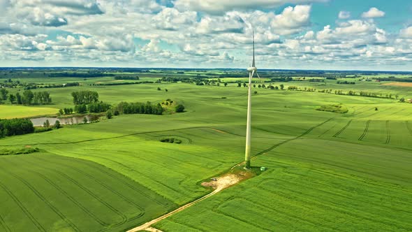 Wind turbines and green field. Alternative energy in Poland.