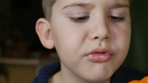 Teen Schoolboy Closeup Eating Juicy Tasty Persimmon