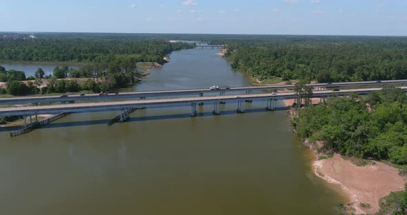 Aerial of cars driving on bridge that crosses over the San Jacinto River in Houston, Texas