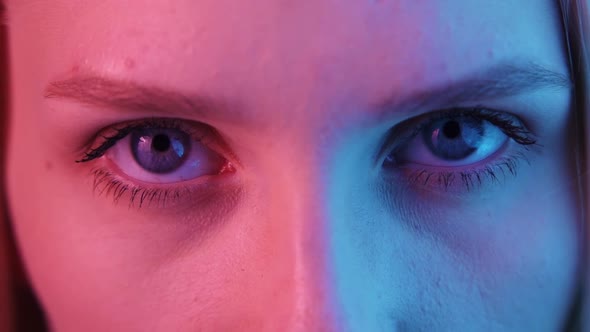 Women's Eyes in Neon Light